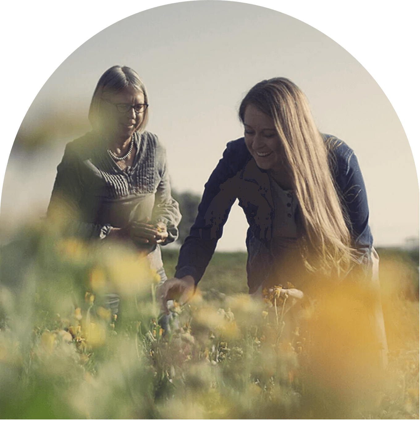 2 women picking herbs